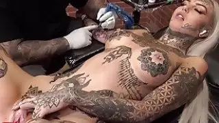 Amber Luke masturbates while getting tattooed