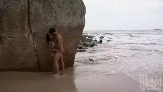 Claudia Bella gives fellatio and fucks passionately on the beach