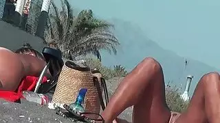 Real amateur nudist hotties with naked pussy at the beach