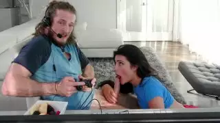 Adria Rae is sucking Brick Danger's cock as he playing video games